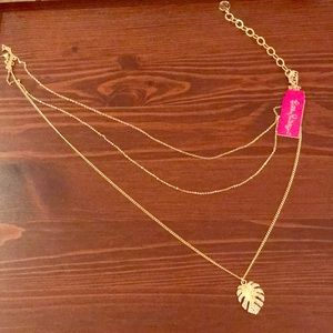 NWT triple strand Lilly necklace!